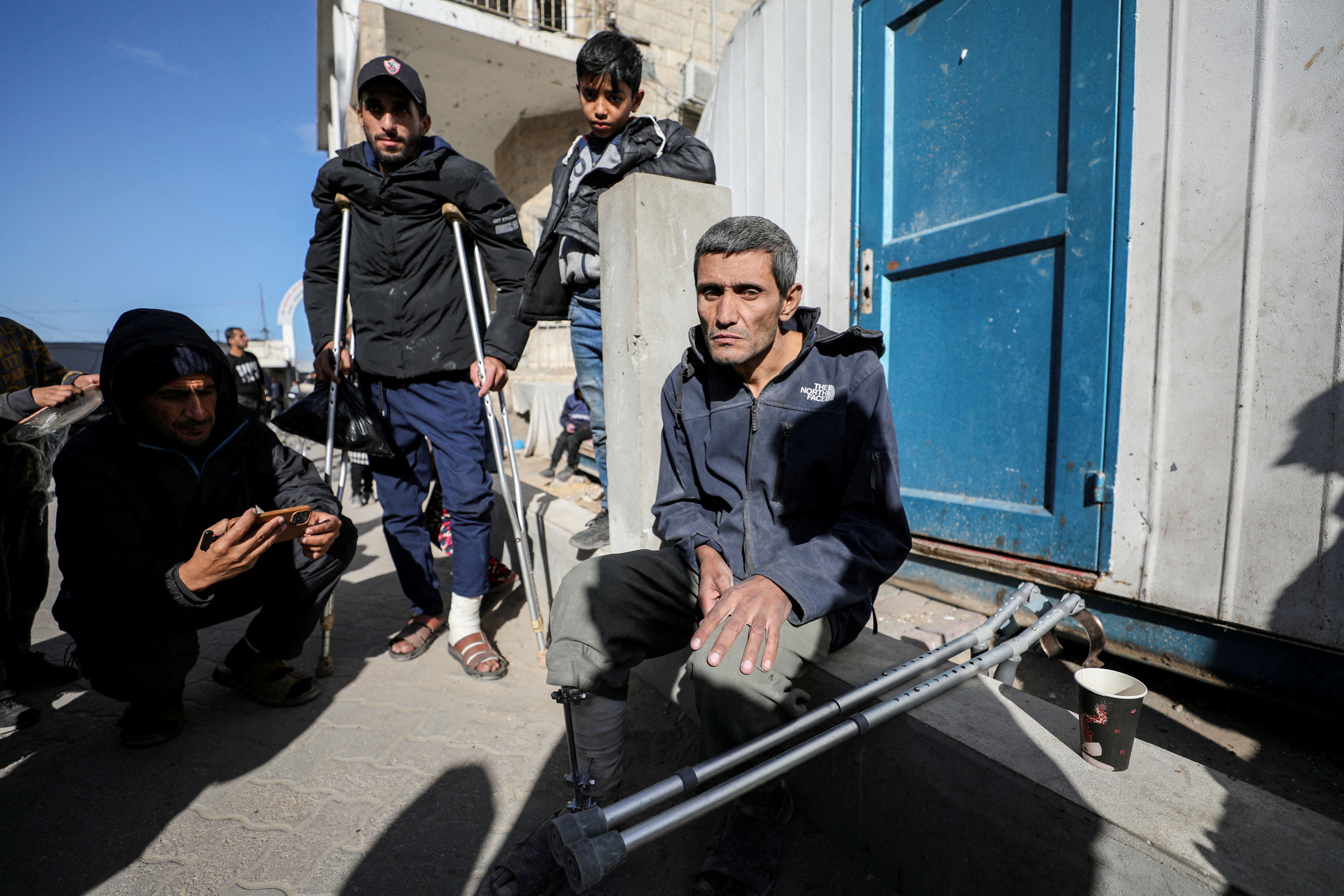Wounded Palestinians arrive at Al-Ahli al-Arabi hospital, in Gaza City