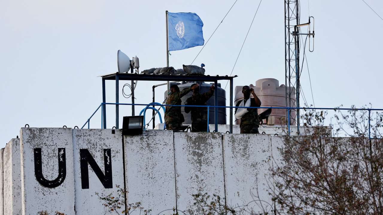 FILE PHOTO: United Nations peacekeepers (UNIFIL) look at the Lebanese-Israeli border
