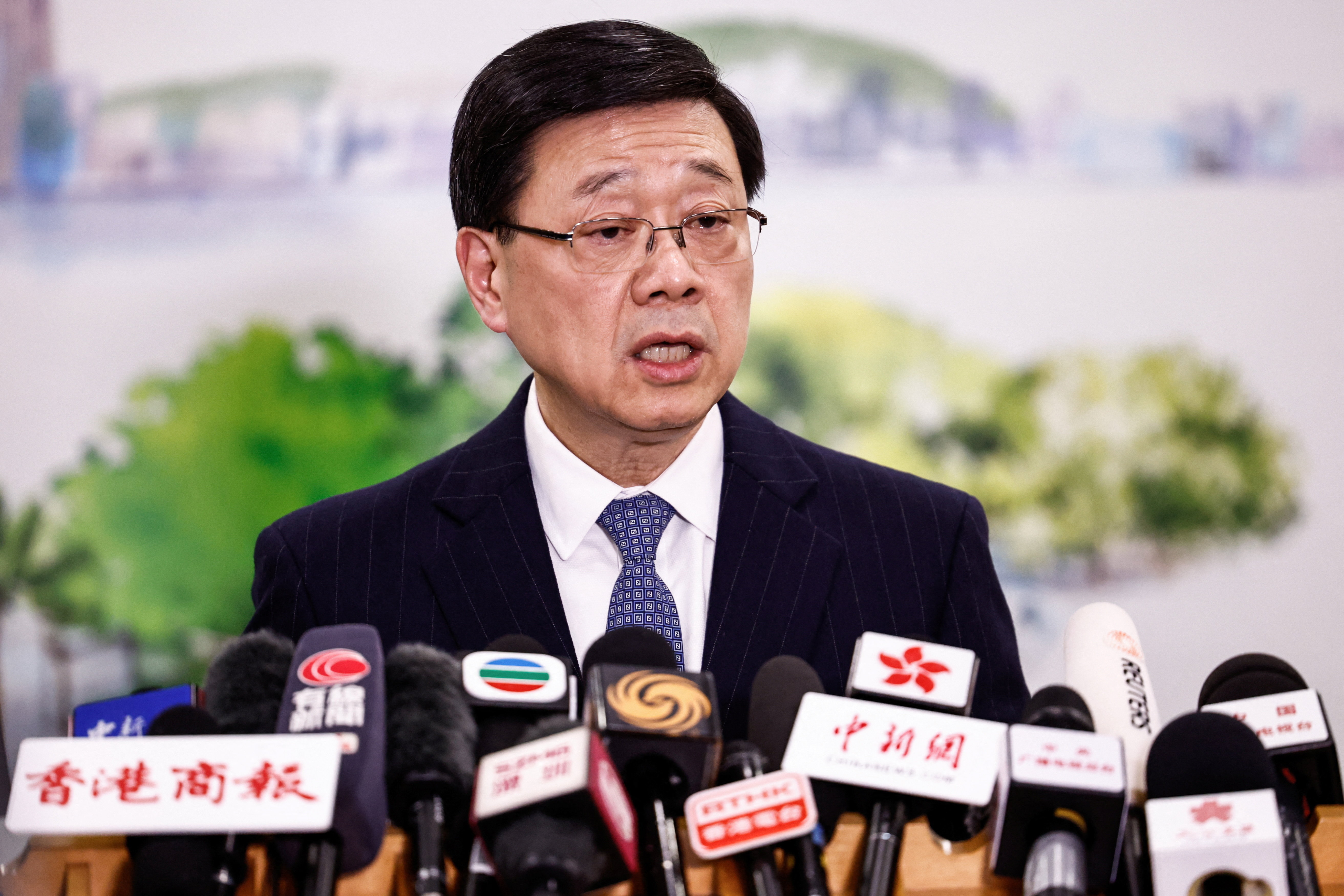 Chief Executive of Hong Kong John Lee speaks during a press conference in Beijing