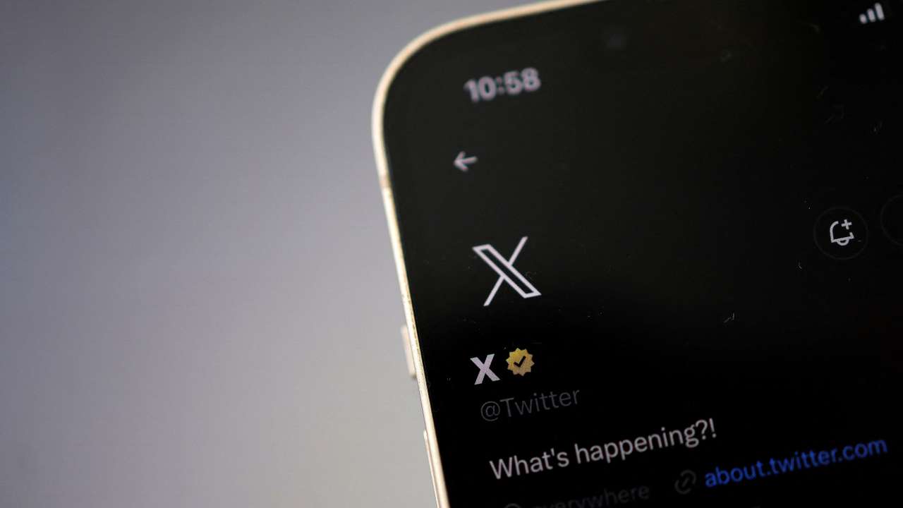Twitter's new logo is seen on the screen of an iPhone, in Ireland