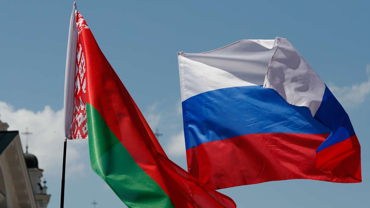 Belarusian and Russian national flags fly during "Day of multinational Russia" event in central Minsk