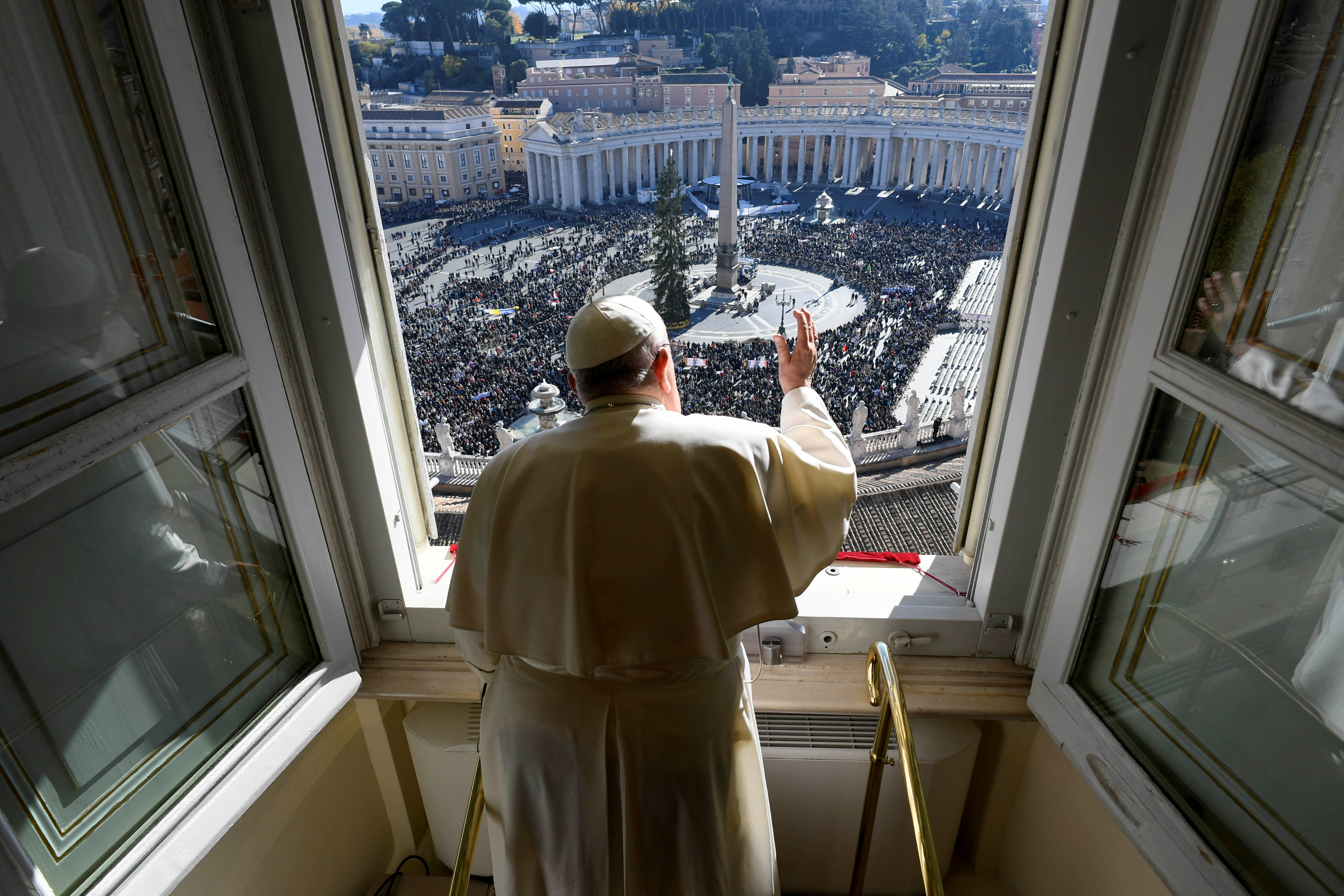 Pope Francis leads the Angelus prayer from his window, at the Vatican