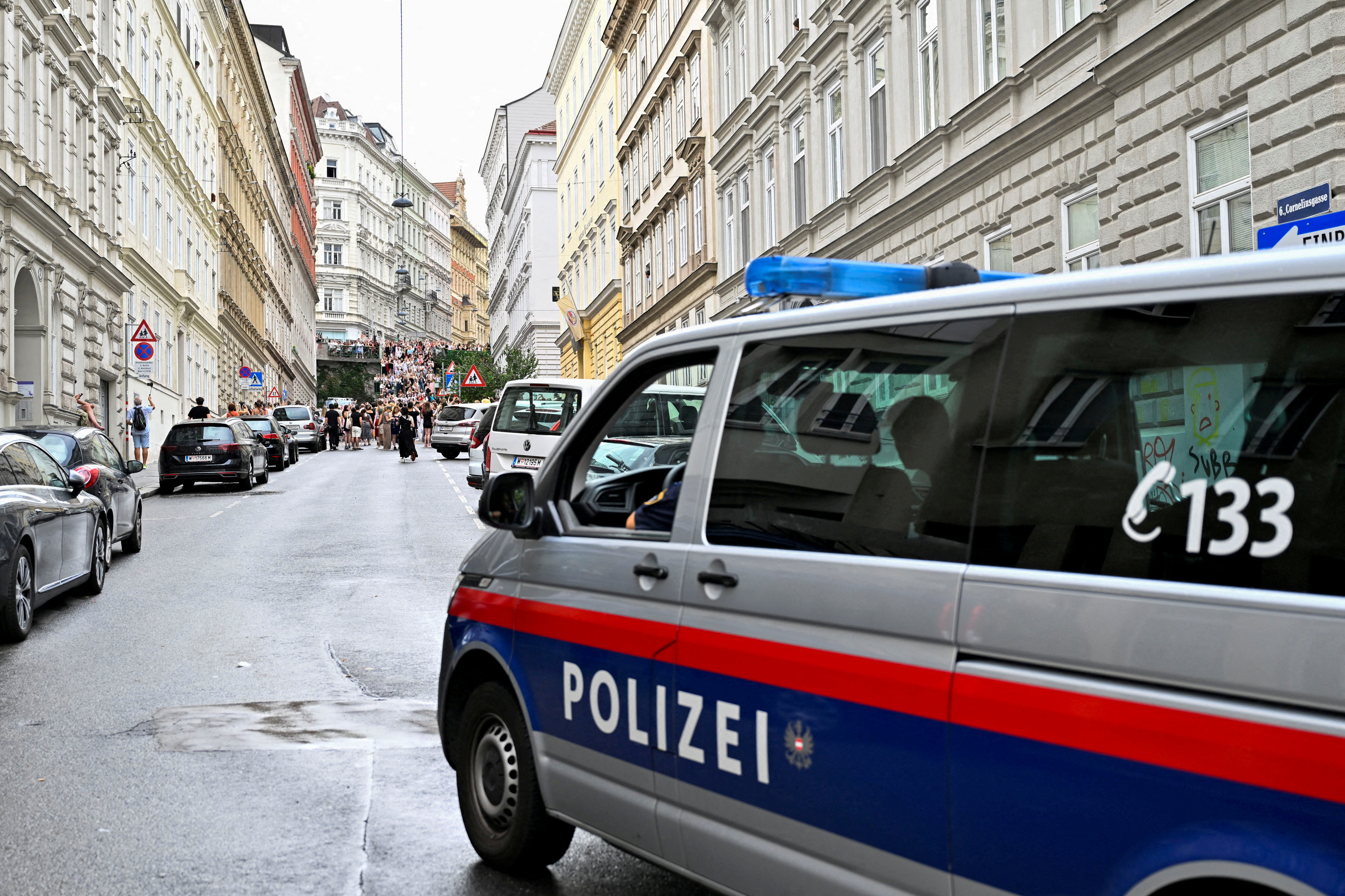 FILE PHOTO: Fans gather after the government confirmed a planned attack at the venue of three Taylor Swift concerts, in Vienna