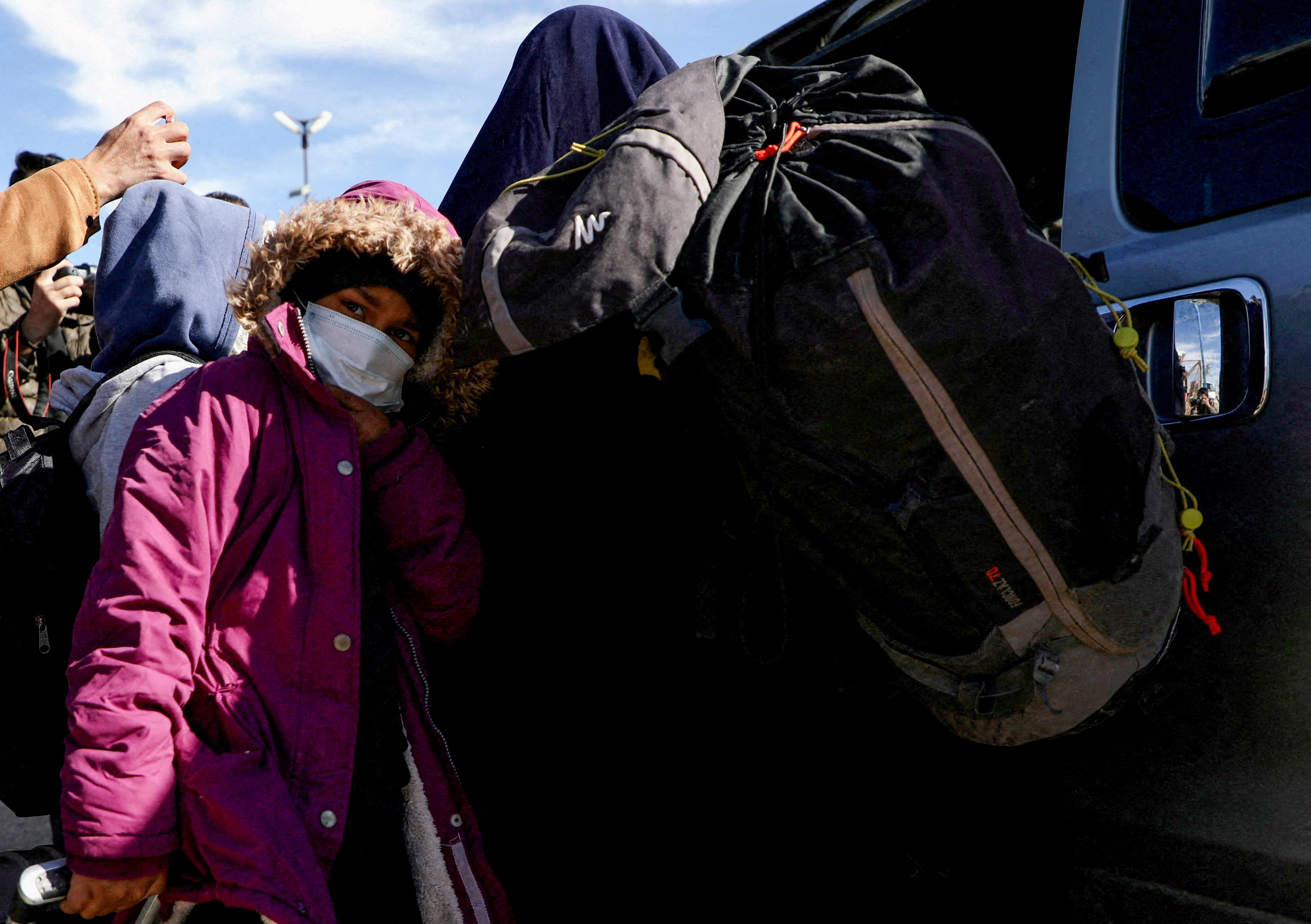 Australian families believed to be linked to the Islamic State militants leave Roj camp near Derik