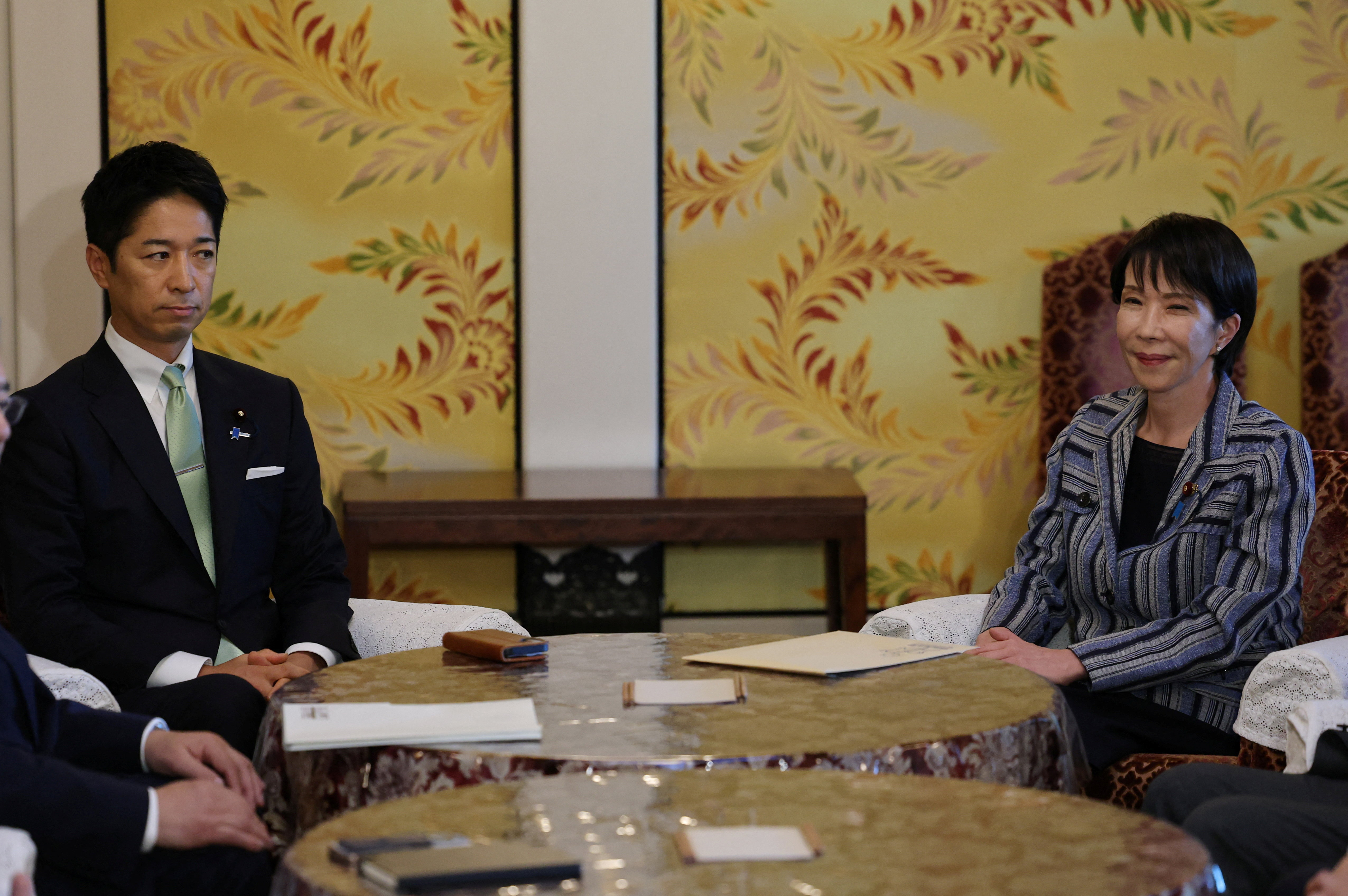 Leader of Japan's ruling Liberal Democratic Party (LDP) Sanae Takaichi meets Japan Innovation Party's co-leader Fumitake Fujita at Japan's National Diet Building, in Tokyo