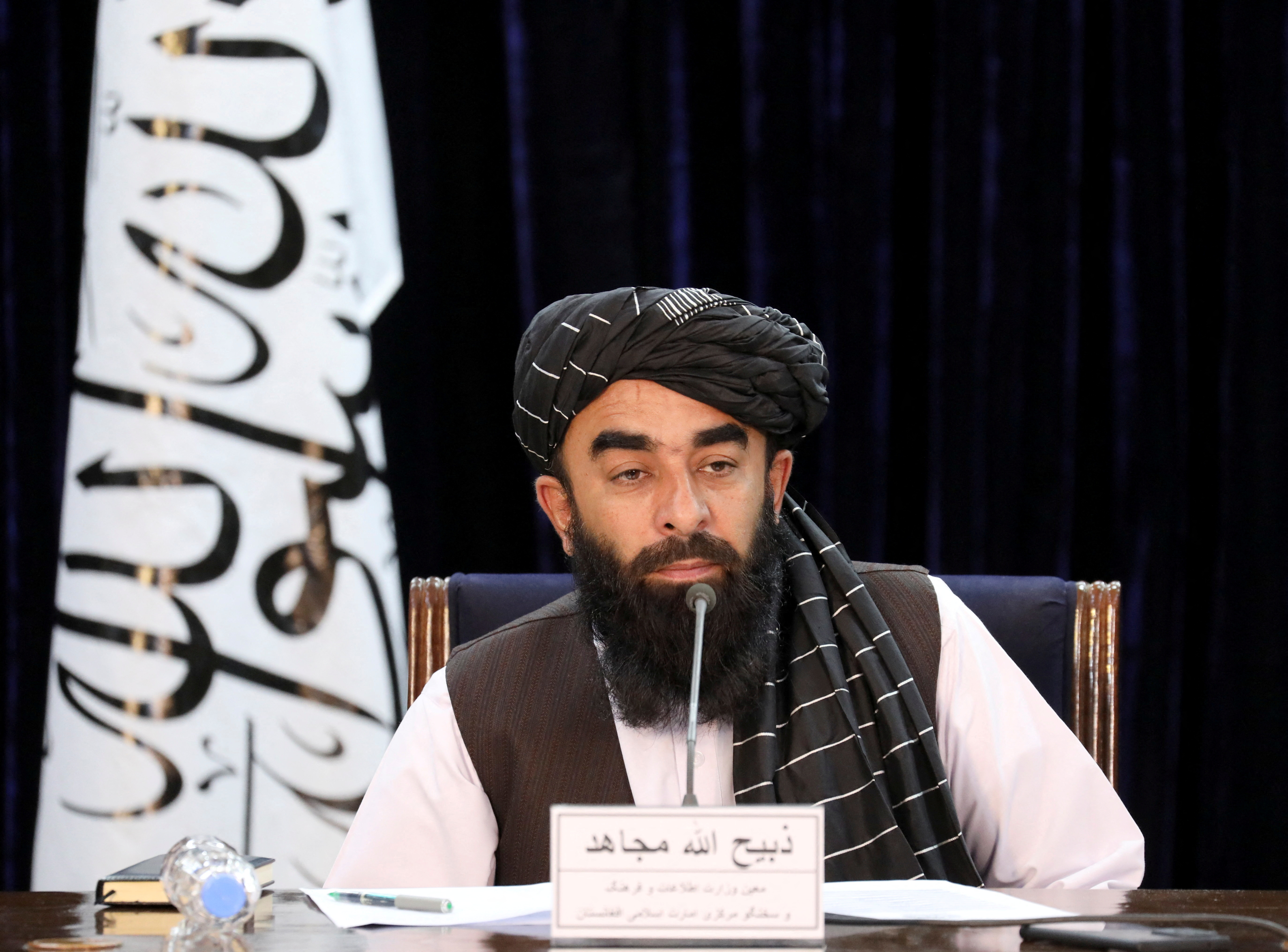 FILE PHOTO: Taliban spokesman Zabihullah Mujahid speaks during news conference in Kabul