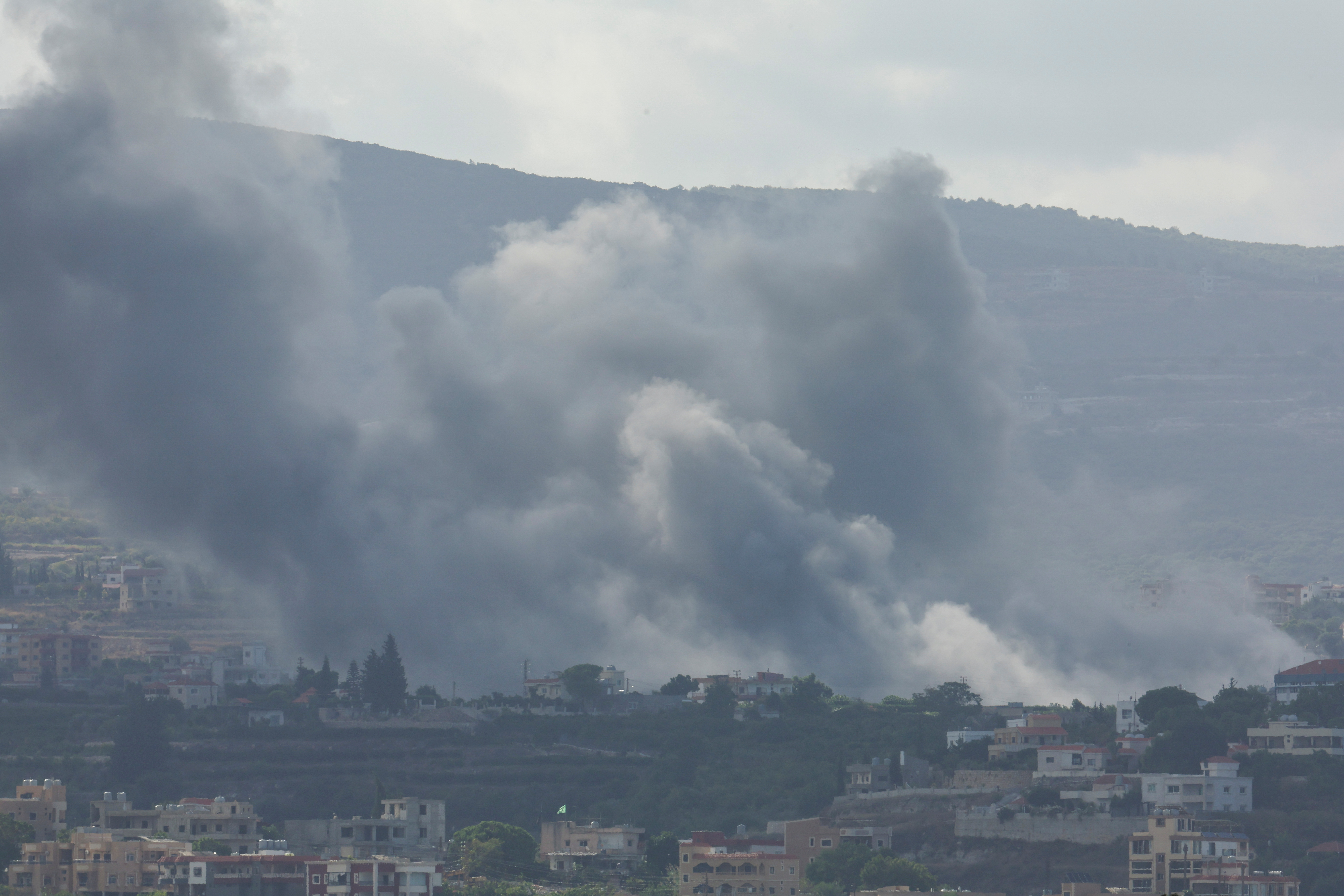 Smoke billows amid the ongoing hostilities between Hezbollah and Israeli forces, as seen from Tyre