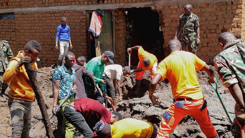Members of the Tanzania Defense Forces and rescuers search for the bodies of people killed following flash floods and landslides near the slopes of Mount Hanang in the Manyara