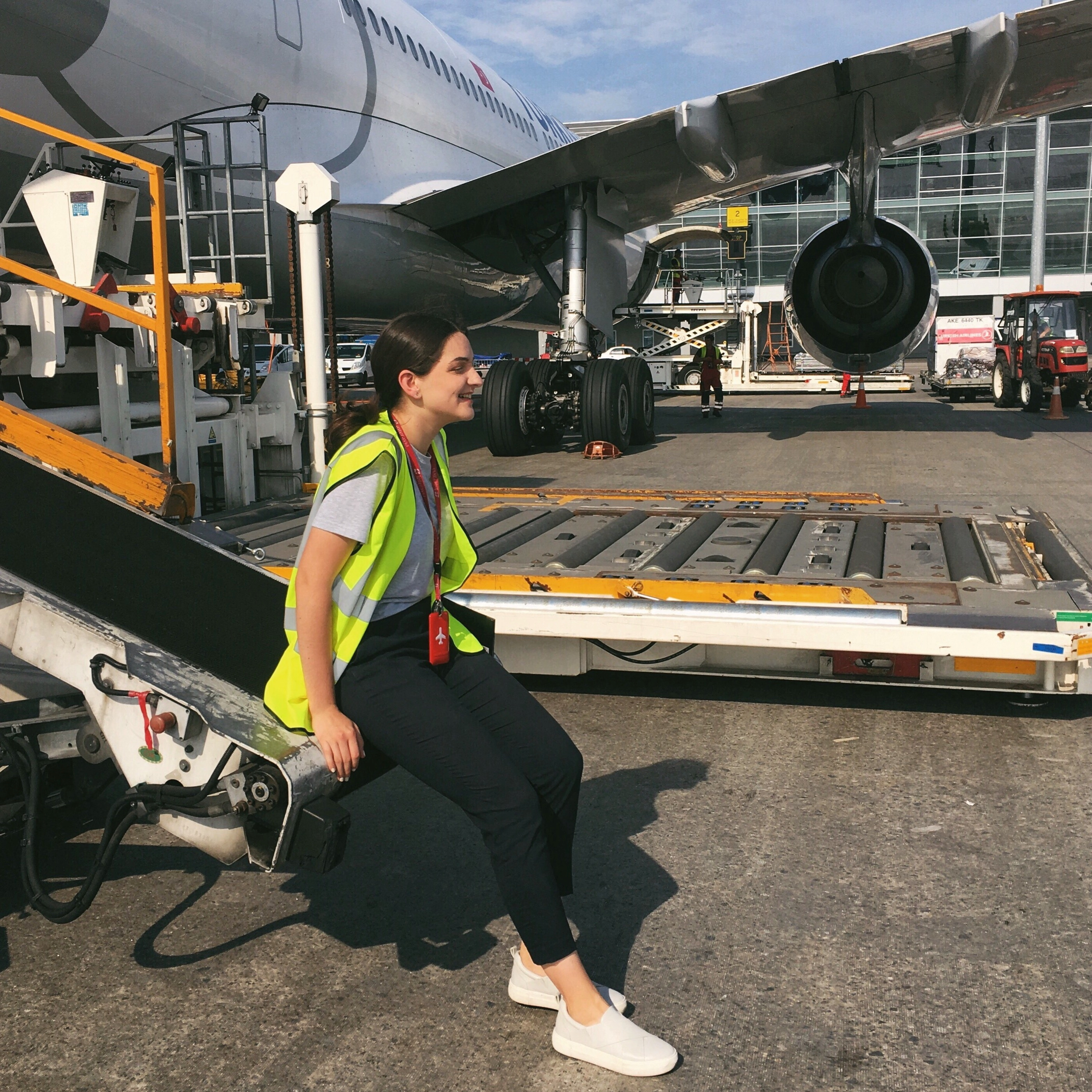 Anastasiia Smyk, CEO of aviation software solutions company Input Soft, sits by an aeroplane at Kyiv's Boryspil International airport