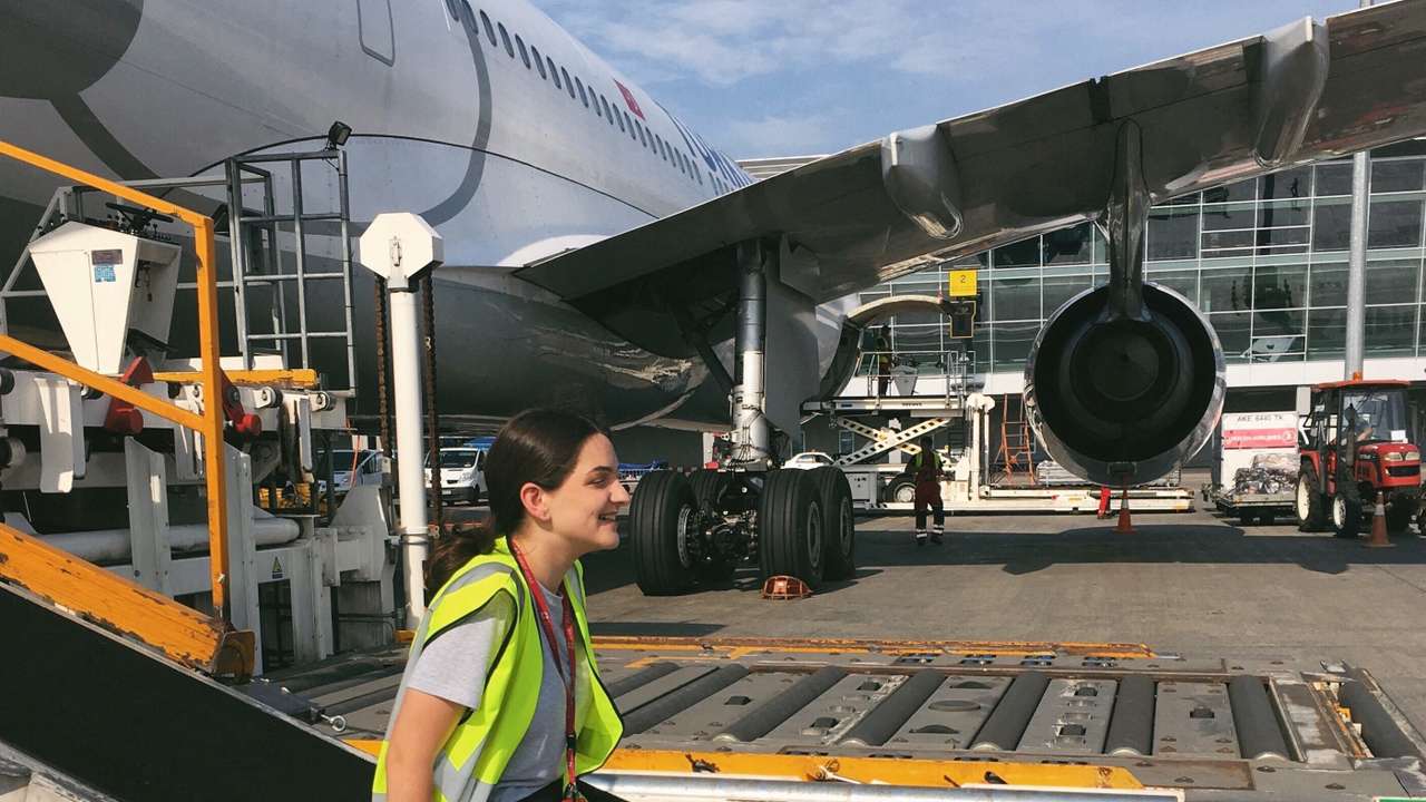 Anastasiia Smyk, CEO of aviation software solutions company Input Soft, sits by an aeroplane at Kyiv's Boryspil International airport