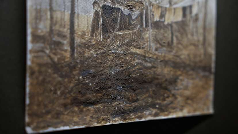 Trench mud is visible on a fragment of a painting displayed at the exhibition of a Ukrainian serviceman Bazylewicz with draws pictures with mud, clay and ashes from a frontline in Kyiv