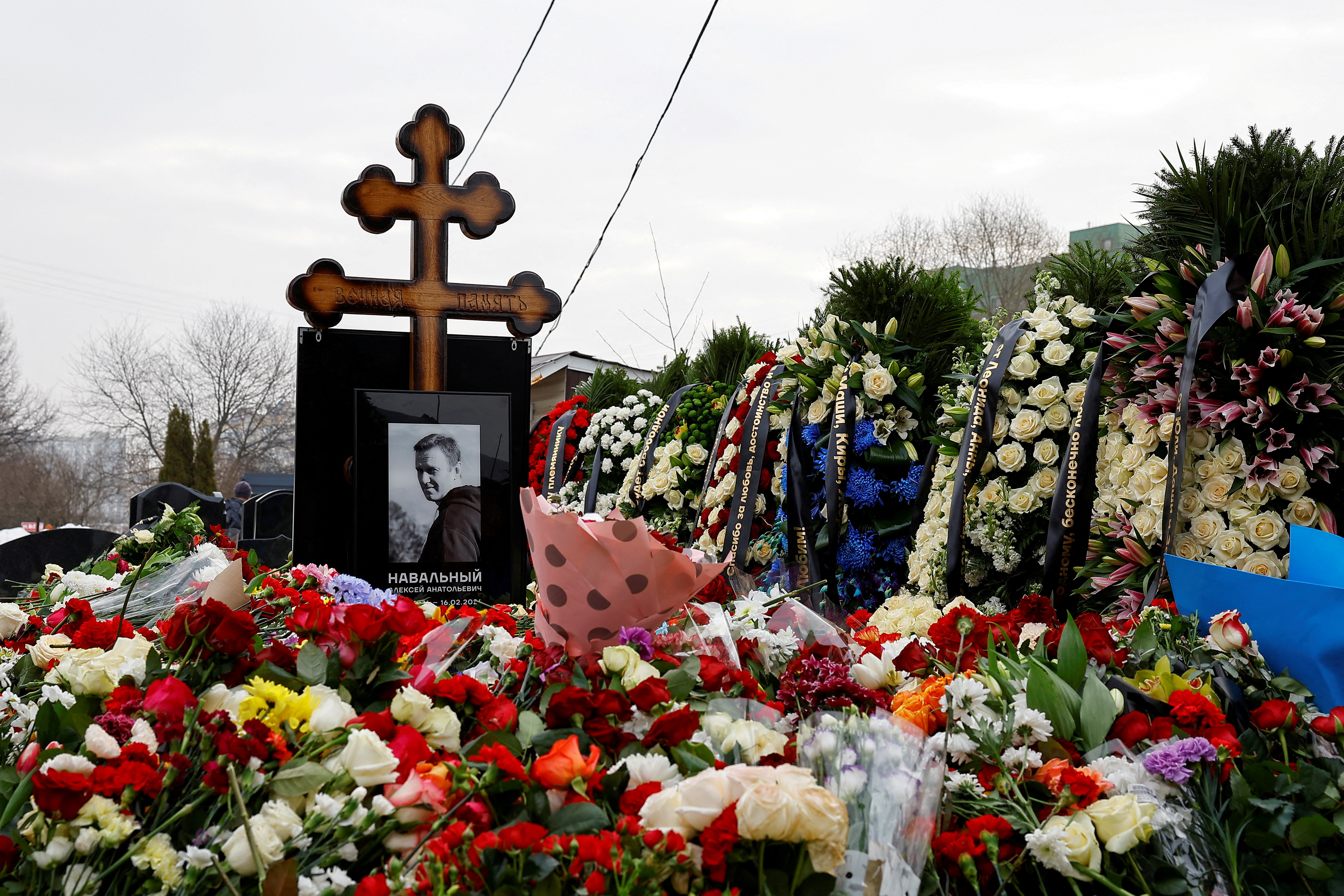 FILE PHOTO: Mourners come to grave of Russian opposition leader Alexei Navalny