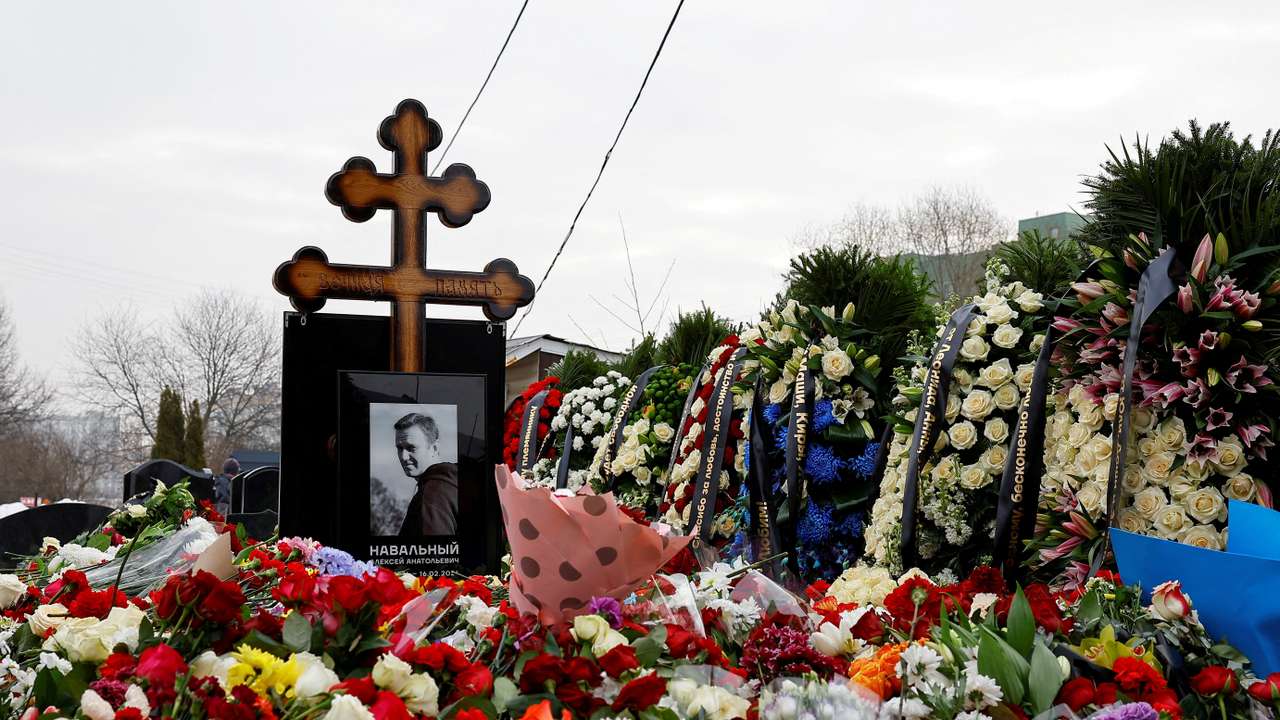 FILE PHOTO: Mourners come to grave of Russian opposition leader Alexei Navalny