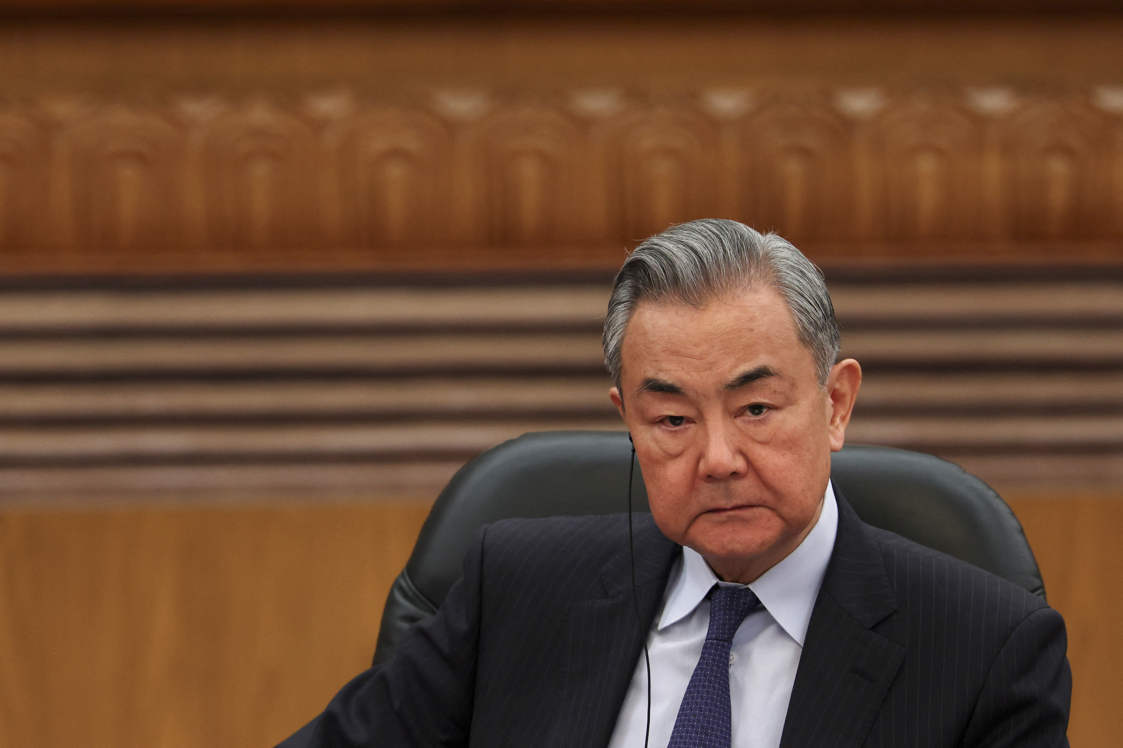 Chinese Foreign Minister Wang Yi attends a meeting with foreign business leaders in Beijing