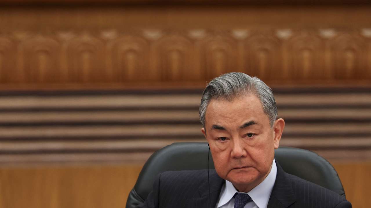 Chinese Foreign Minister Wang Yi attends a meeting with foreign business leaders in Beijing