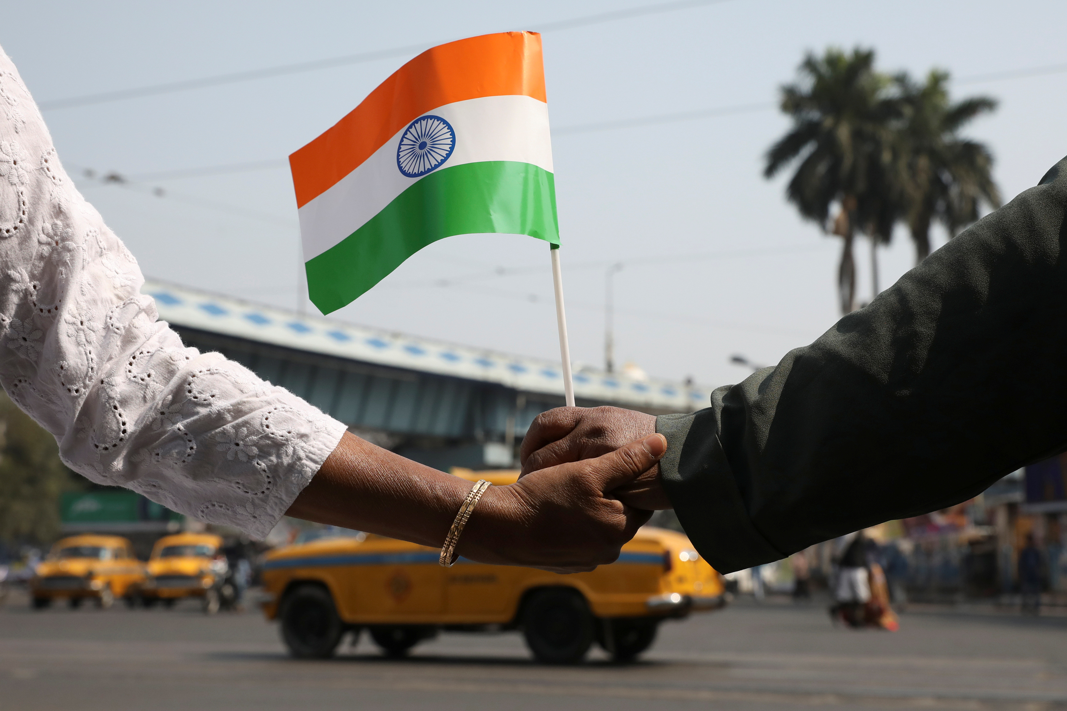 Demonstrators form a human chain after Republic Day celebrations to protest against a new citizenship law in Kolkata
