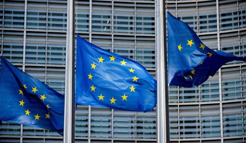 FILE PHOTO: European Union flags fly outside the European Commission headquarters in Brussels