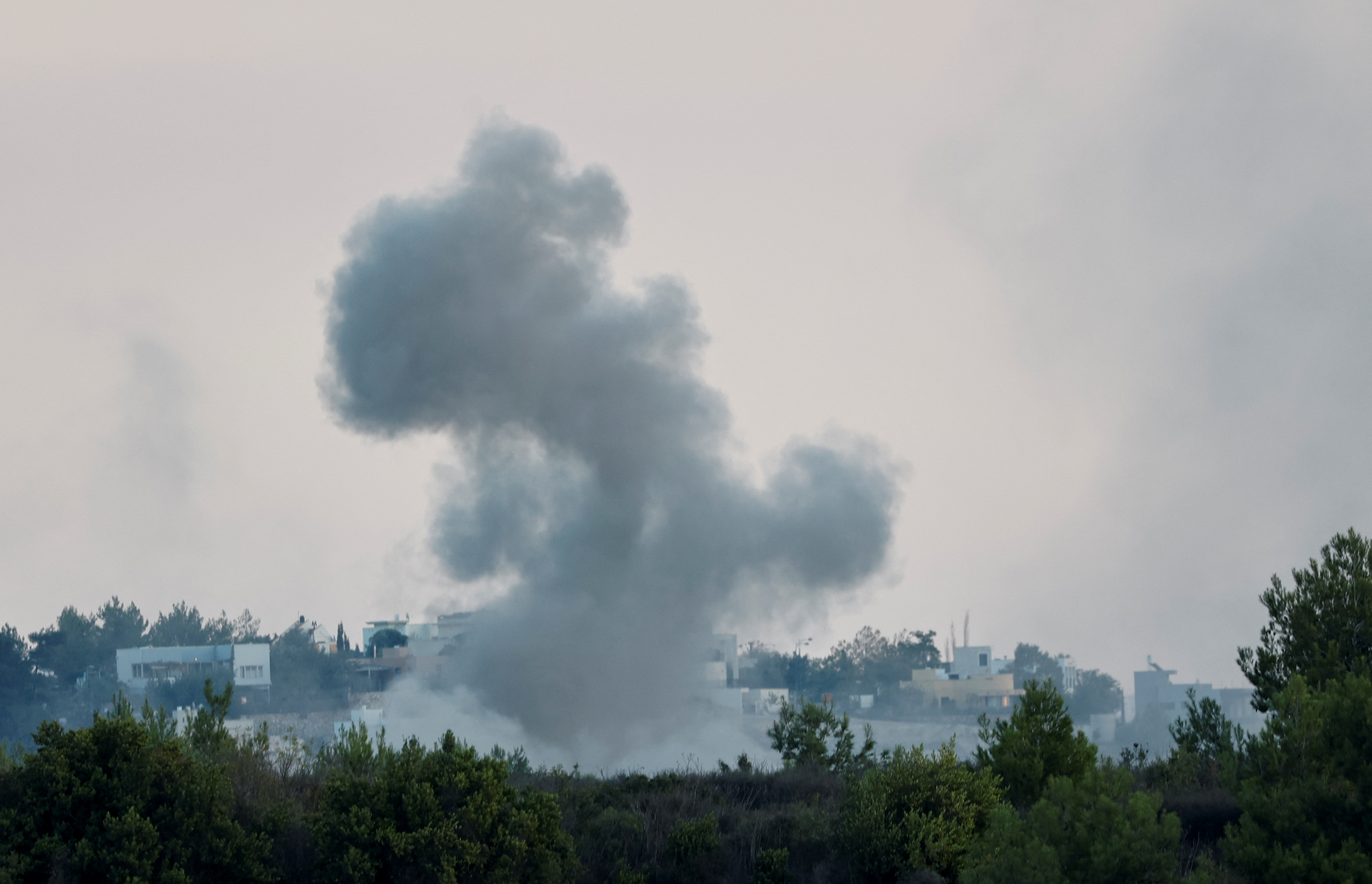 Smoke rises after Israeli shelling , as seen from Lebanese side, near the border with Israel, southern Lebanon
