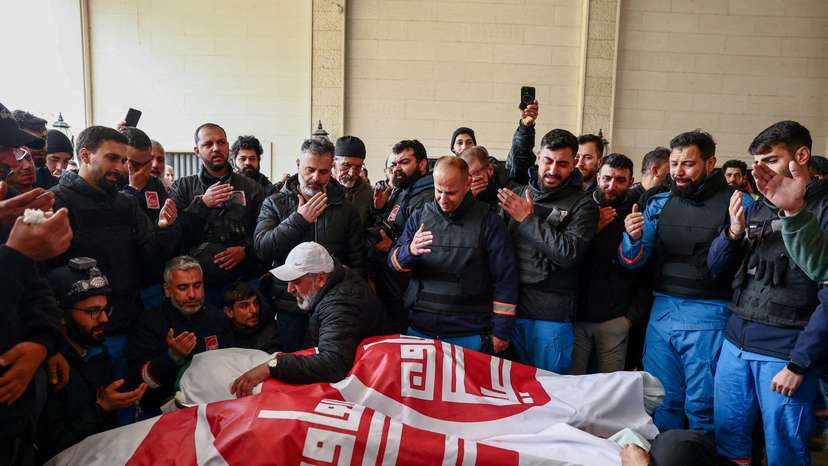 People mourn two paramedics killed by Israeli strike, in Nabatieh