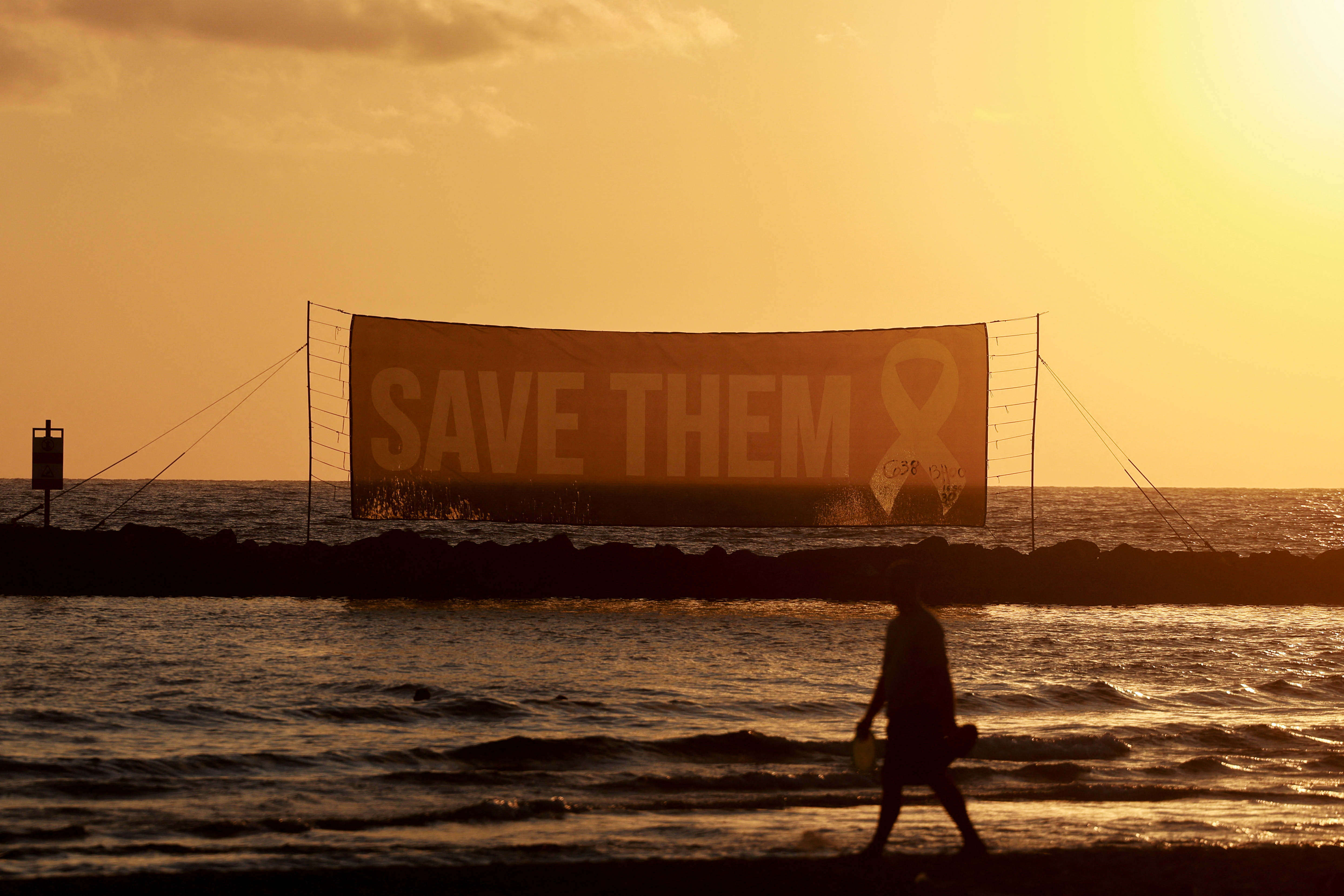 Protest to demand the immediate release of all hostages held in Gaza, opposite the U.S. Consulate in Tel Aviv
