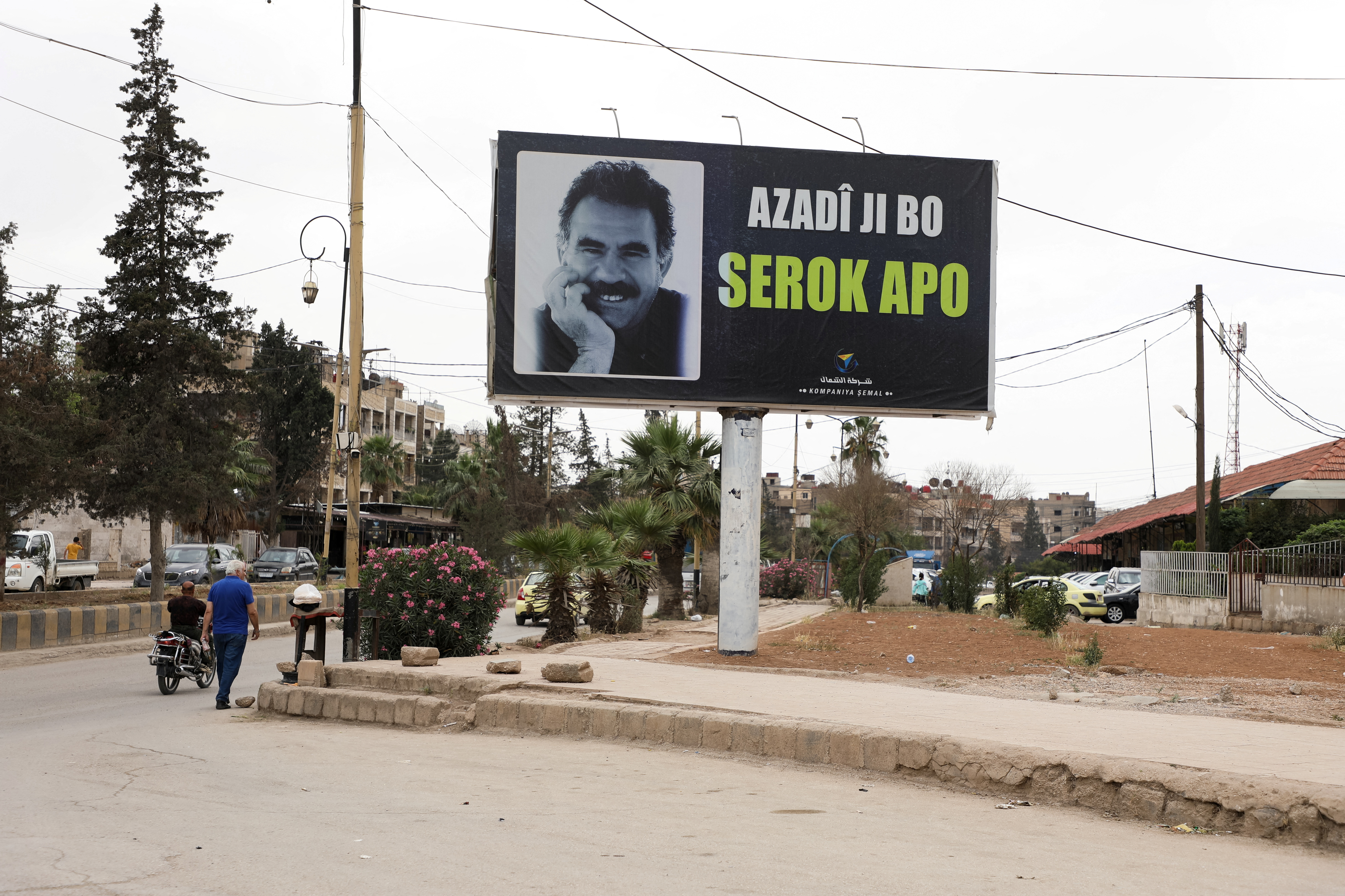 A sign depicts jailed Kurdish militant leader Abdullah Ocalan in Qamishli