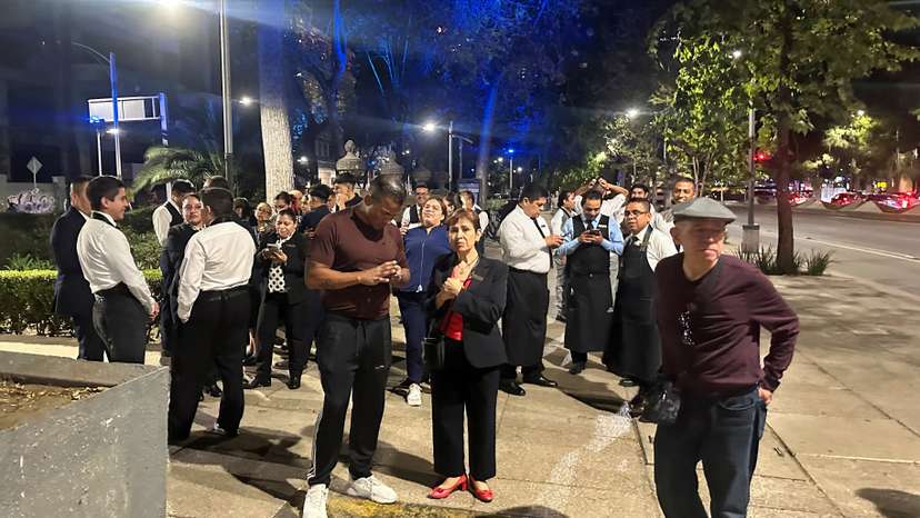 People wait outside their homes and buildings in Mexico City