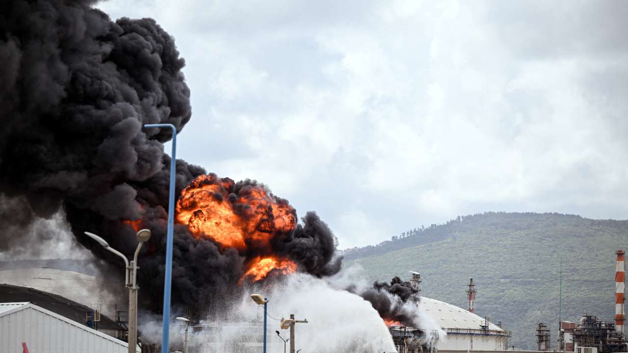 A blaze after Israel's Fire and Rescue Service said that an industrial building and a fuel tanker at Israel's Oil Refineries were hit by debris from an intercepted Iranian missile, in Haifa
