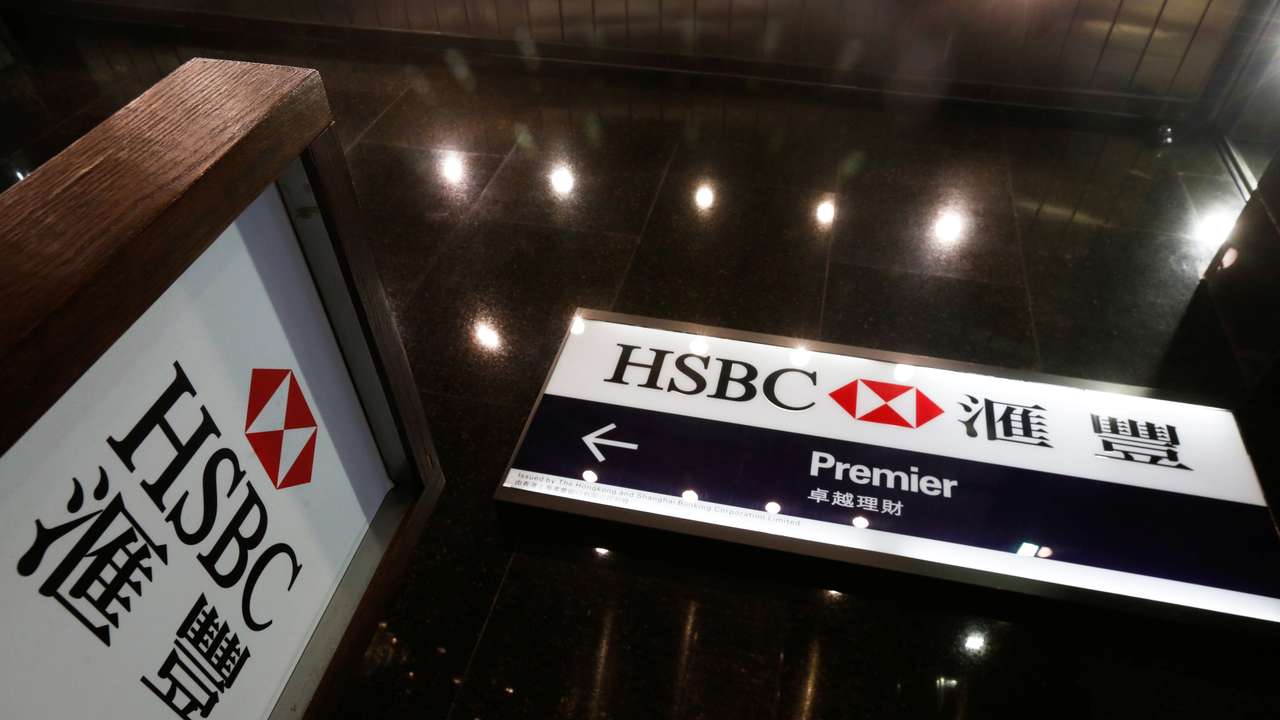 Logos of HSBC are displayed at a major branch at the financial Central district in Hong Kong