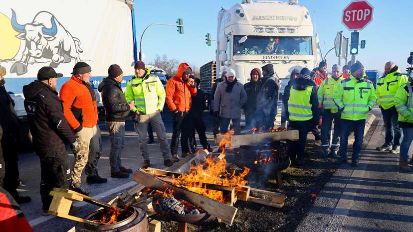 German farmers take part in a protest against the cut of vehicle tax subsidies