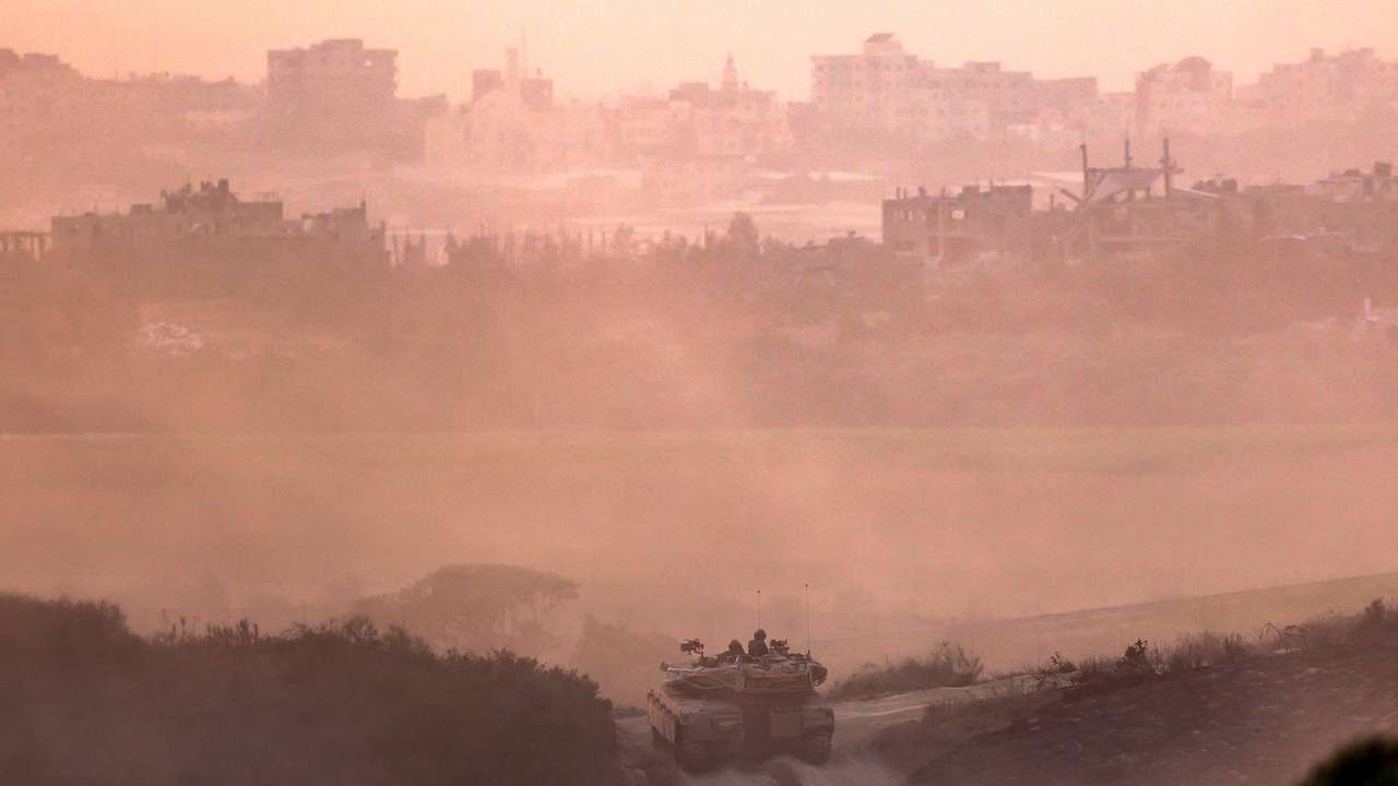 Israeli tank drives near the border with Gaza Strip