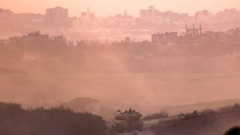 Israeli tank drives near the border with Gaza Strip
