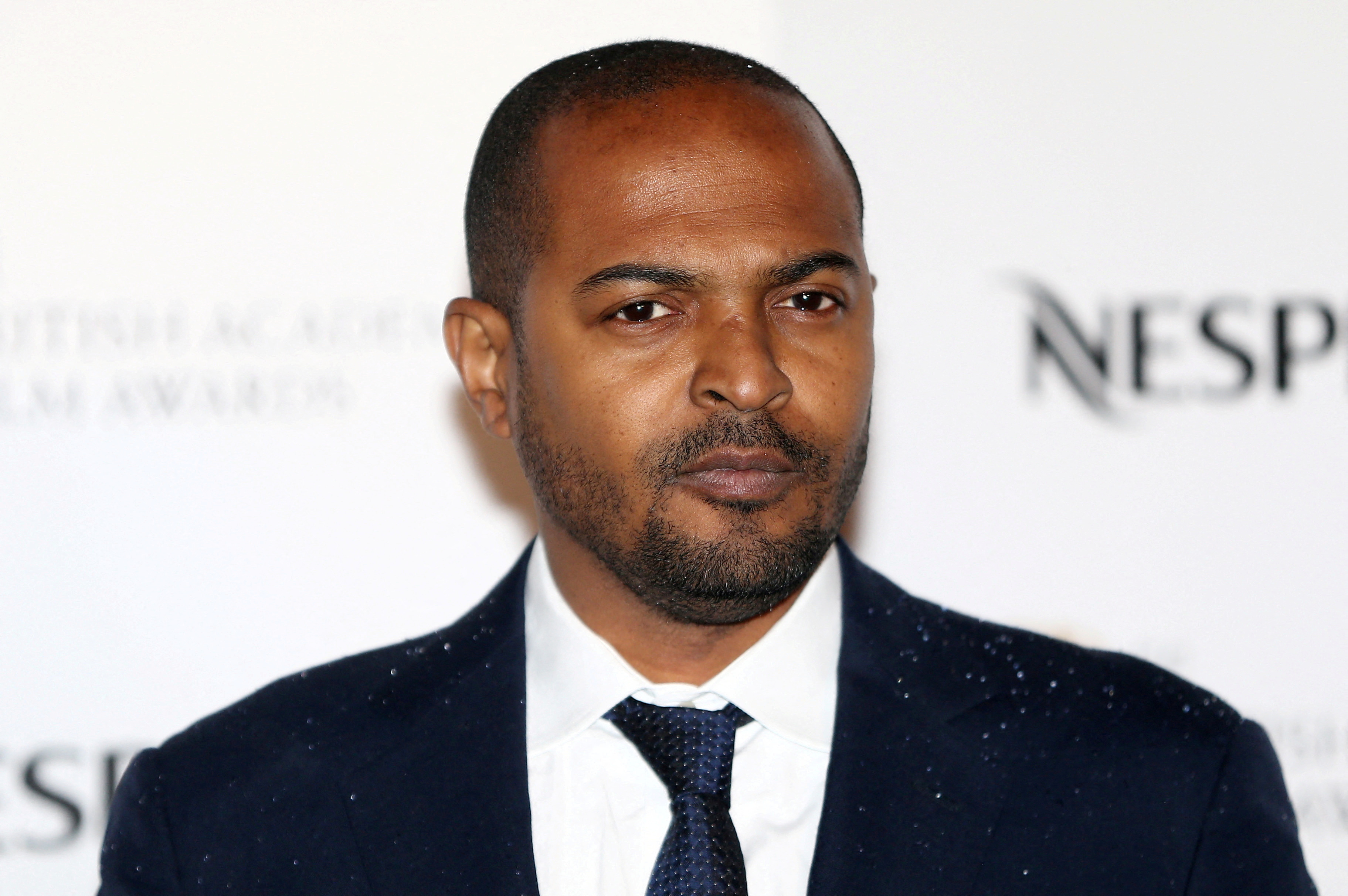 FILE PHOTO: Actor Noel Clarke poses for photographers at the British Academy Film Awards Nominees Party at Kensington Palace in London