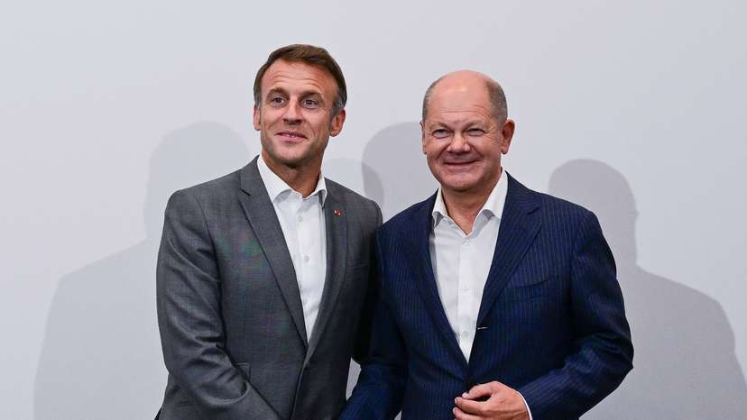 France's President Emmanuel Macron and Germany's Chancellor Olaf Scholz meet during the 33rd Evian Annual Meeting to promote economic cooperation at Evian