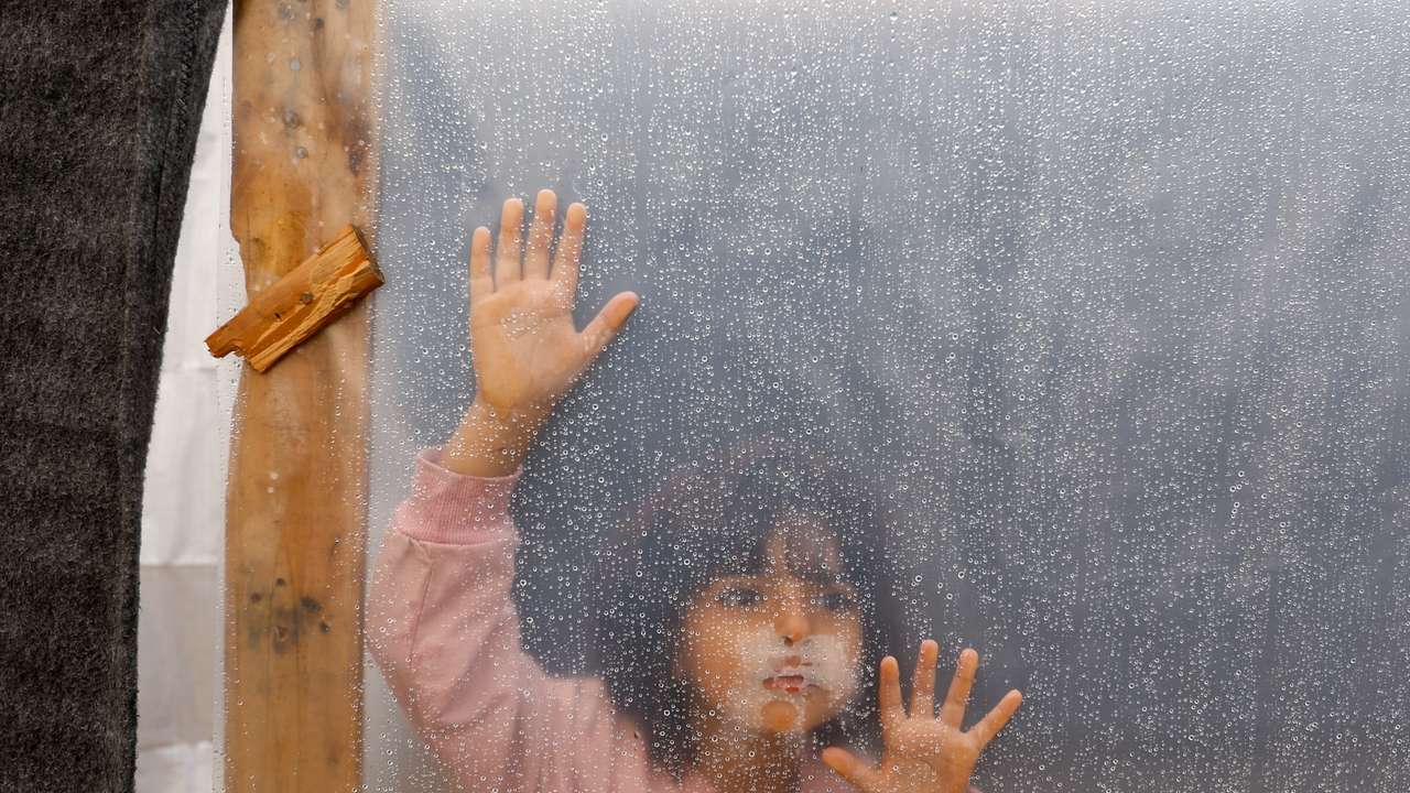 Displaced Palestinians shelter in a tent camp, in Khan Younis