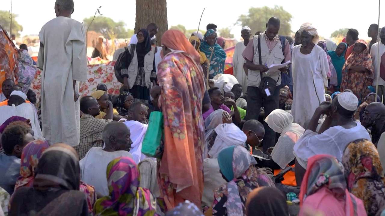 FILE PHOTO: Displaced Sudanese gather and sit in makeshift tents after fleeing Al-Fashir city in Darfur