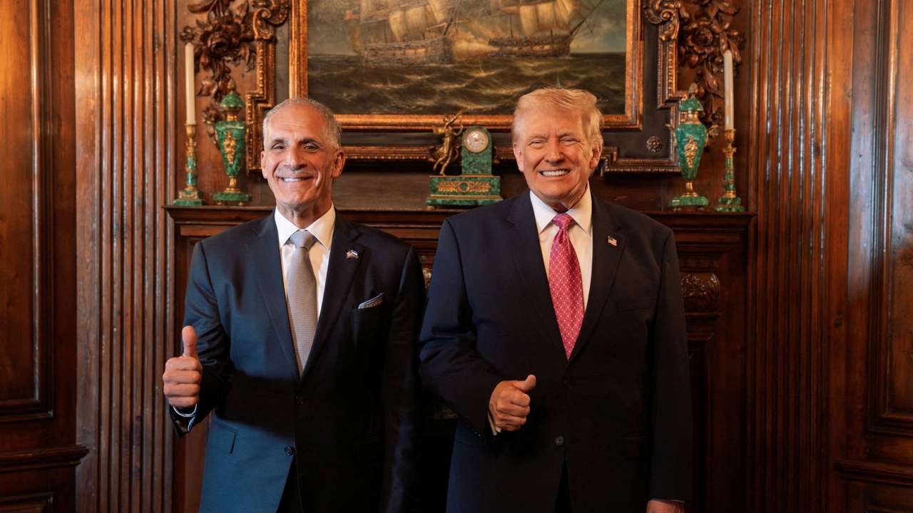 U.S. President Donald Trump poses with Honduras' President Nasry Asfura at Trump's Mar-a-Lago residence, in Palm Beach
