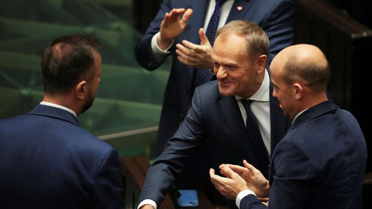 Leader of the Civic Coalition (KO) Donald Tusk shakes hands with leader of the Polish People's Party (PSL) Wladyslaw Kosiniak-Kamysz after the Parliament voted in favor of him becoming the Prime Minister, in Parliament, in Warsaw