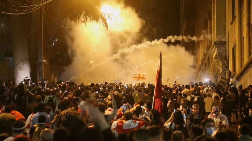 FILE PHOTO: Demonstrators hold a rally to protest against a bill on "foreign agents", in Tbilisi