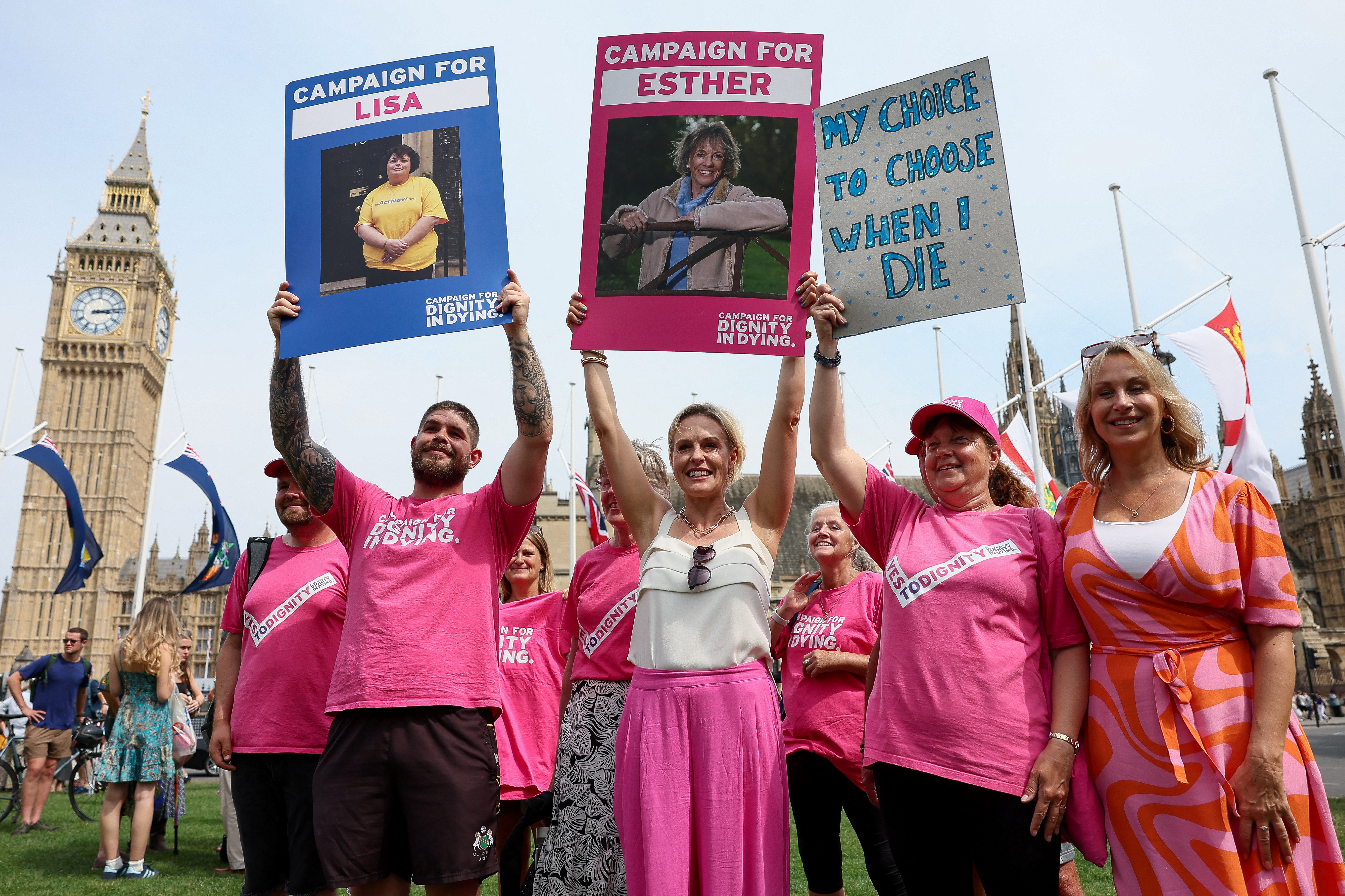 People react after Britain's parliament voted in favour of a bill to legalise assisted dying, London