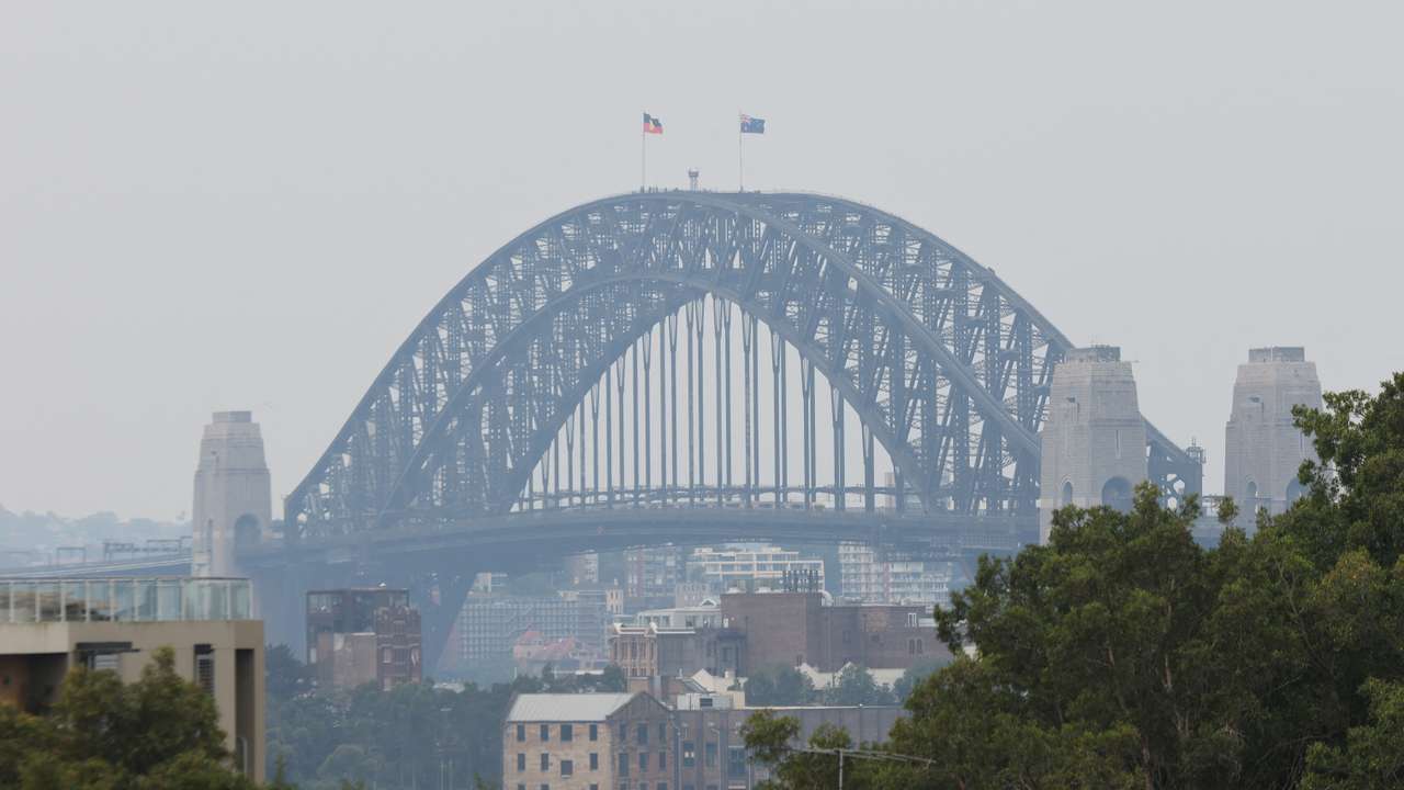 A view of the Sydney Harbour Bridge shrouded in smog from nearby bushfires in Sydney