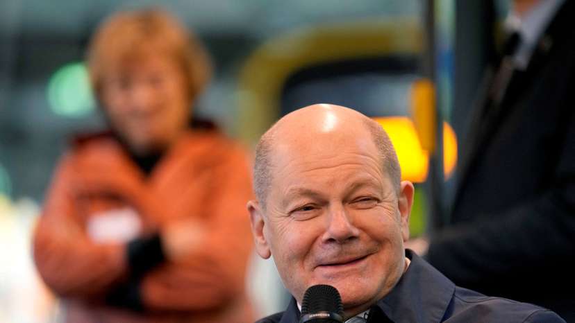 FILE PHOTO: German chancellor Olaf Scholz sits in a tram as he talks to participants of the Democracy project 'metro-polis' in Dresden