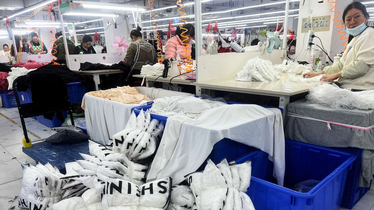 FILE PHOTO: FILE PHOTO: Workers work at a production line manufacturing clothing for Shein at a factory in Guangzhou