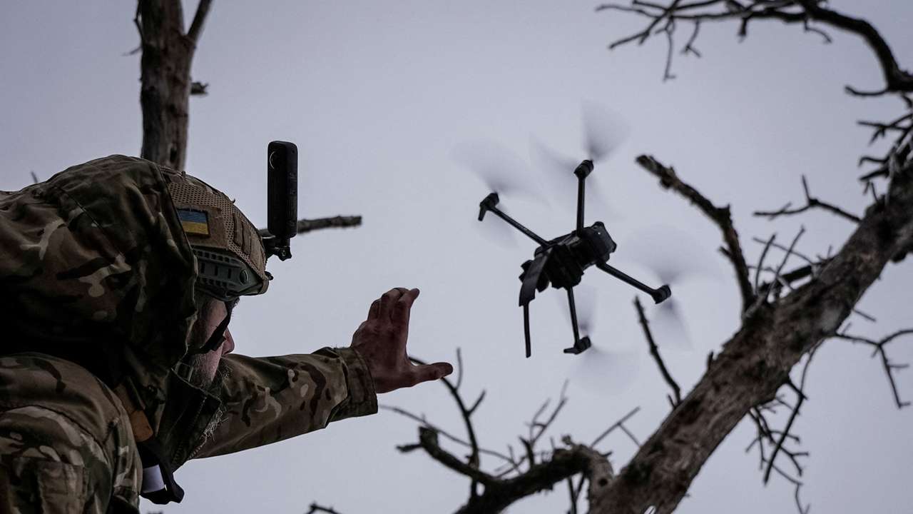 Ukrainian serviceman launches a kamikaze FPV drone at a front line near the city of Bakhmut