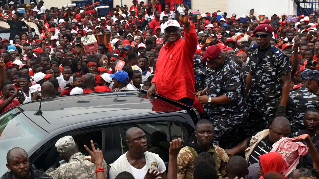 FILE PHOTO: President of Sierra Leone Ernest Bai Koroma waves to supporters of the ruling All Peoples Congress party during a rally ahead of the March 7 presidential election in Makeni