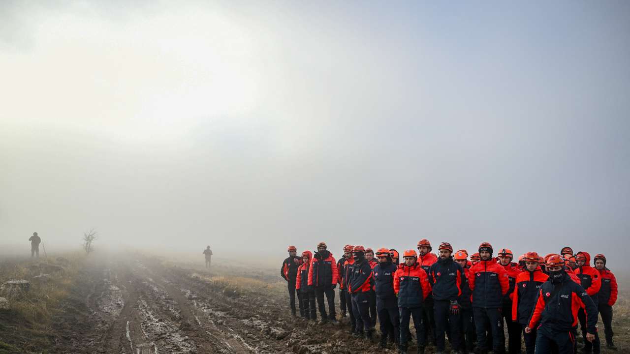 Turkish search and rescue team members arrive to the crashsite of a jet carrying Libyan army's chief of staff near Kesikkavak village