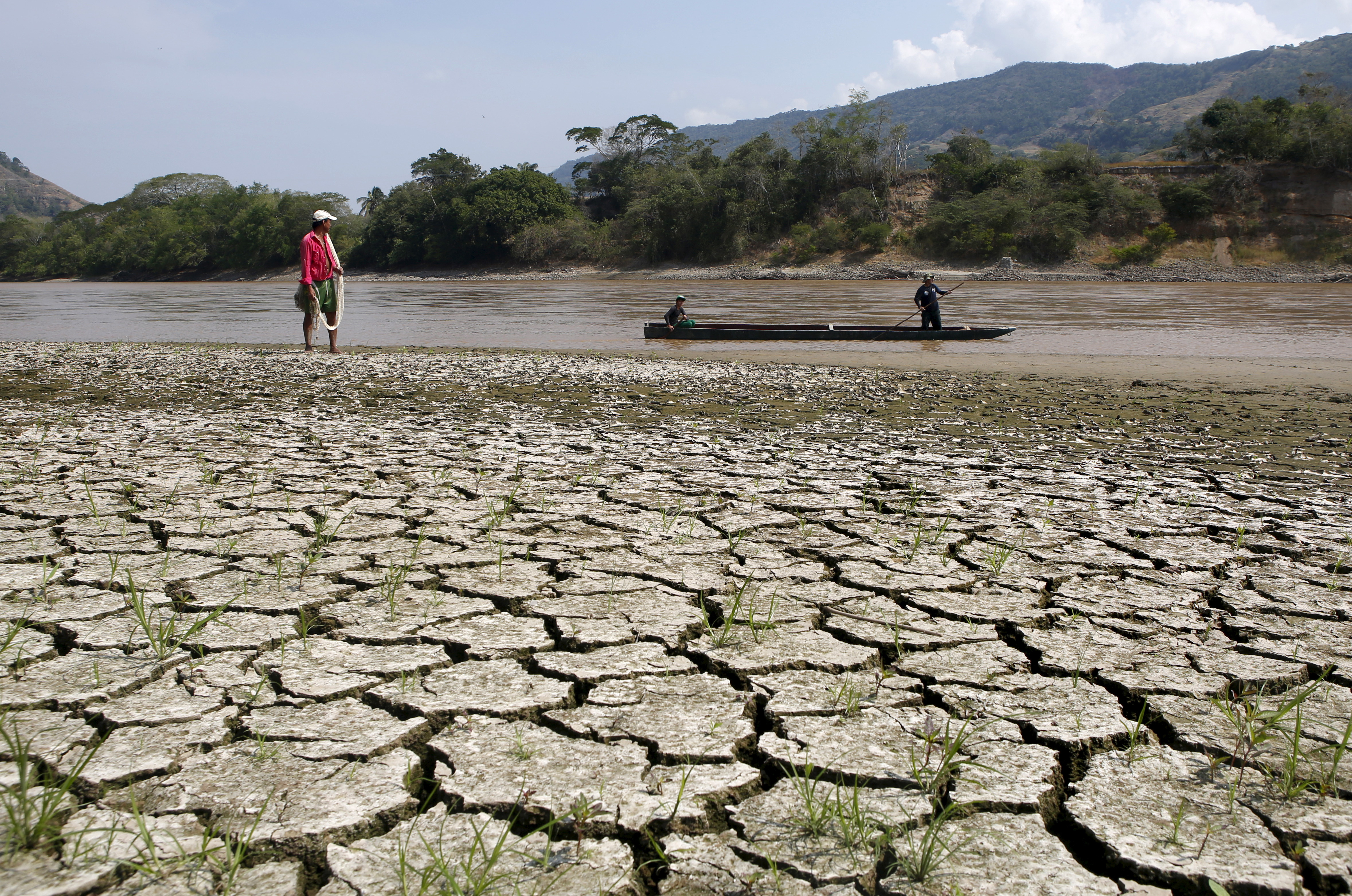Fisherman Gabriel Barreto stands on the shore of the Magdalena river, the longest and most important river in Colombia, in the city of Honda