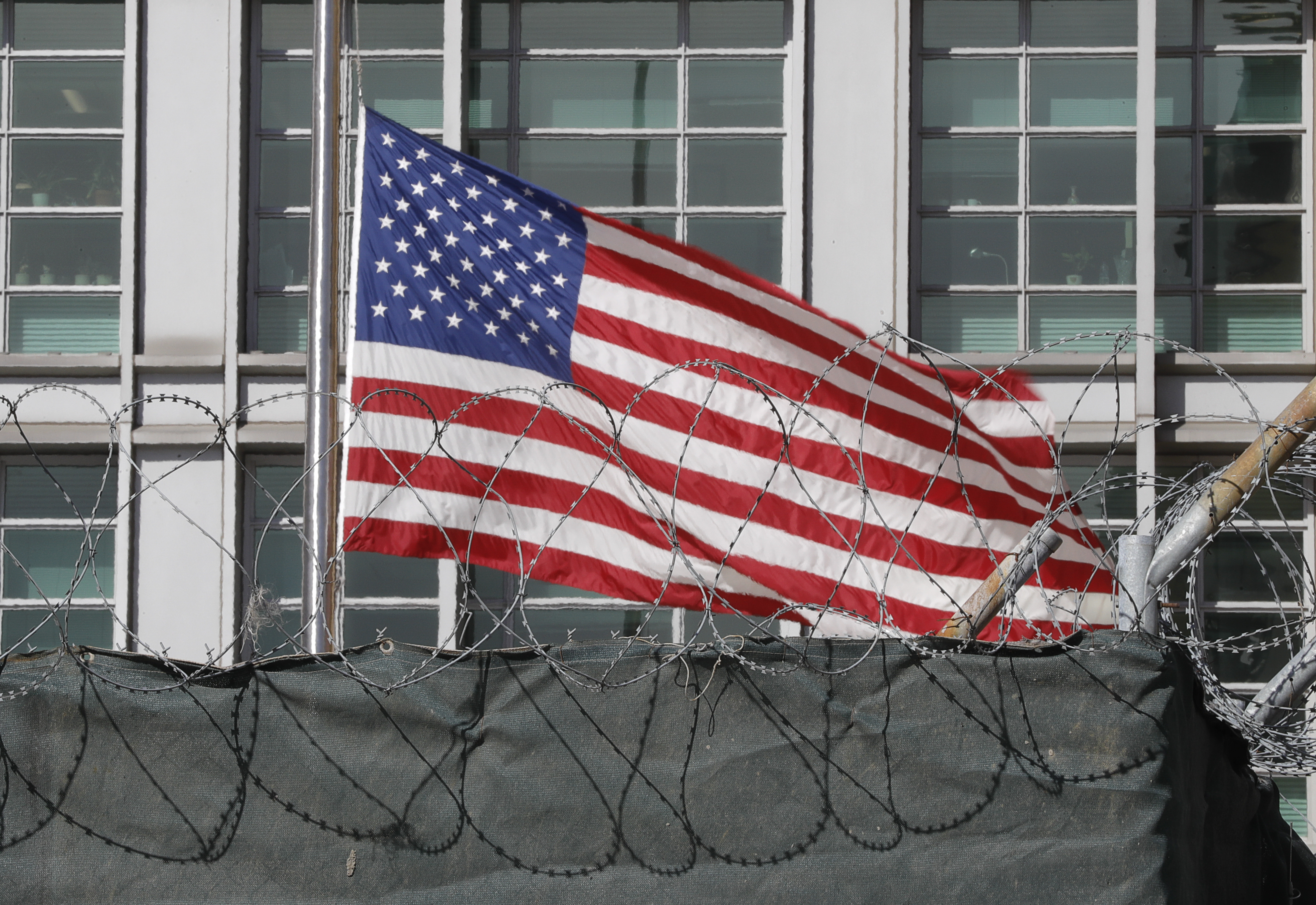 A flag flies behind an enclosure on the territory of the U.S. embassy in Moscow