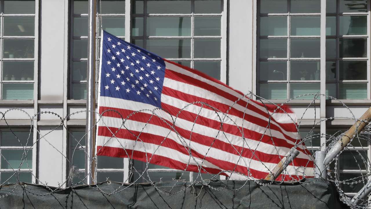 A flag flies behind an enclosure on the territory of the U.S. embassy in Moscow