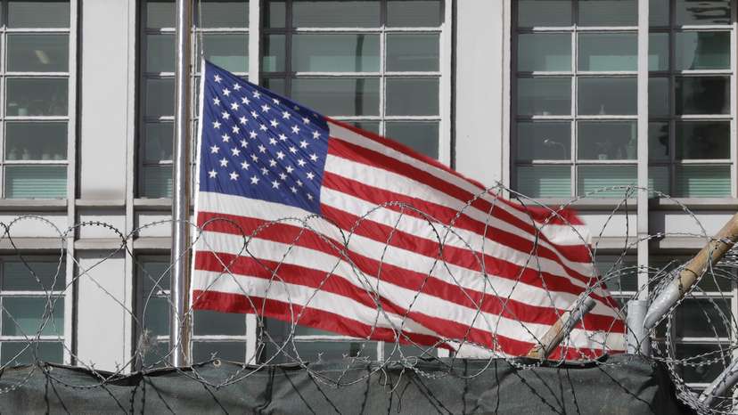 A flag flies behind an enclosure on the territory of the U.S. embassy in Moscow