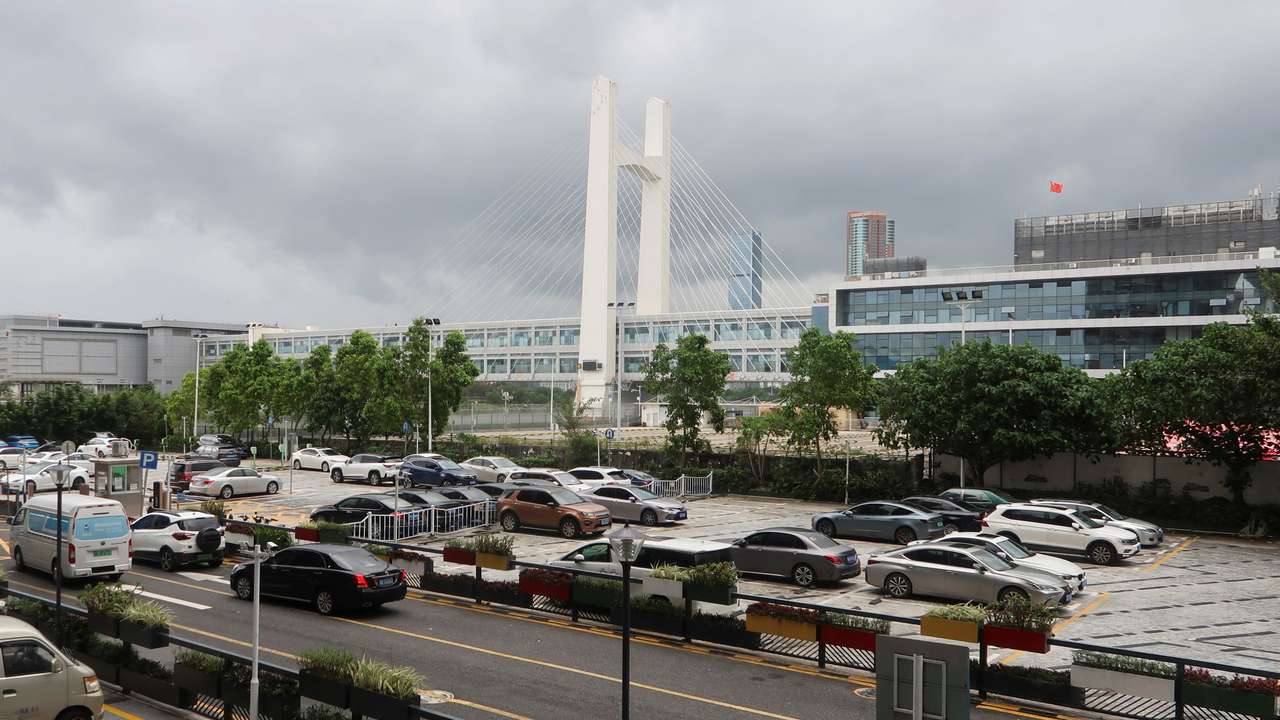FILE PHOTO: Cars park beside Futian Checkpoint in Shenzhen